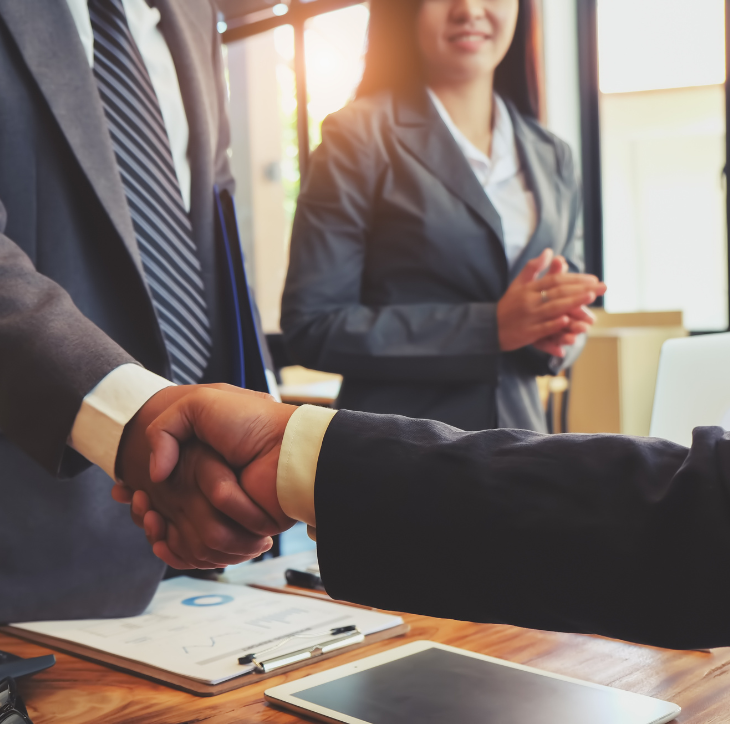 Man shaking hands while making deal 
